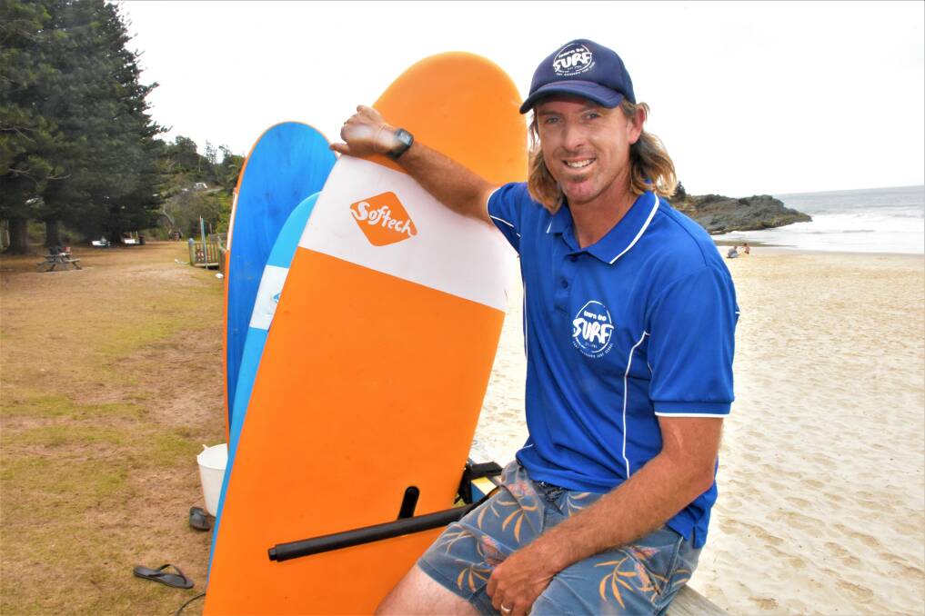 RIDING A WAVE OF SUCCESS: Port Macquarie Surf School operator Wayne 'Huddo' Hudson at Flynns Beach.