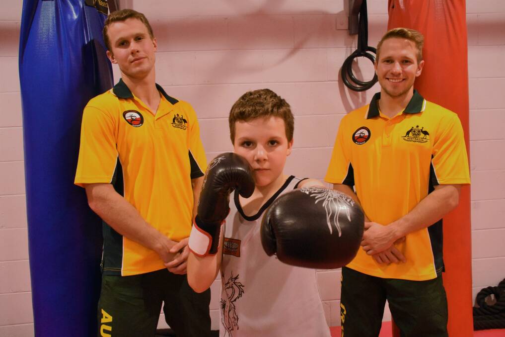STANDING STRONG: Port Macquarie martial artists Michael Woodward, Brock Gow and Sam Cobourn.
