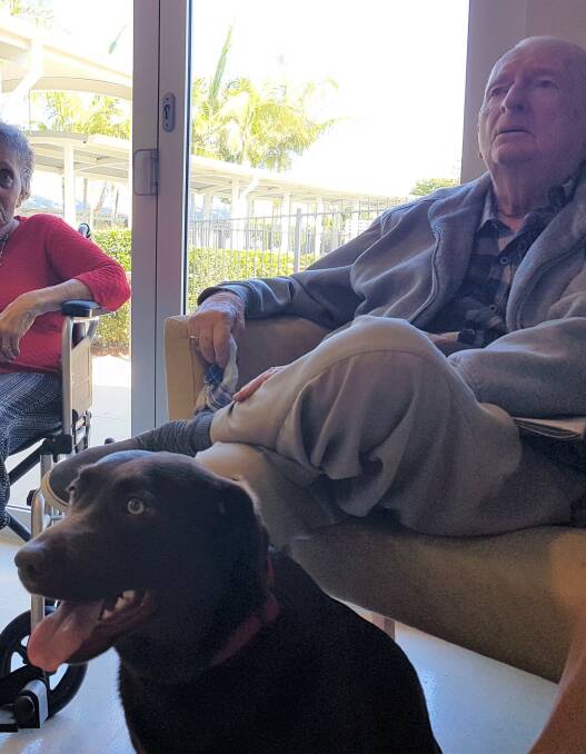 TOURING POOCH: Molly with resident, John Boyd.
