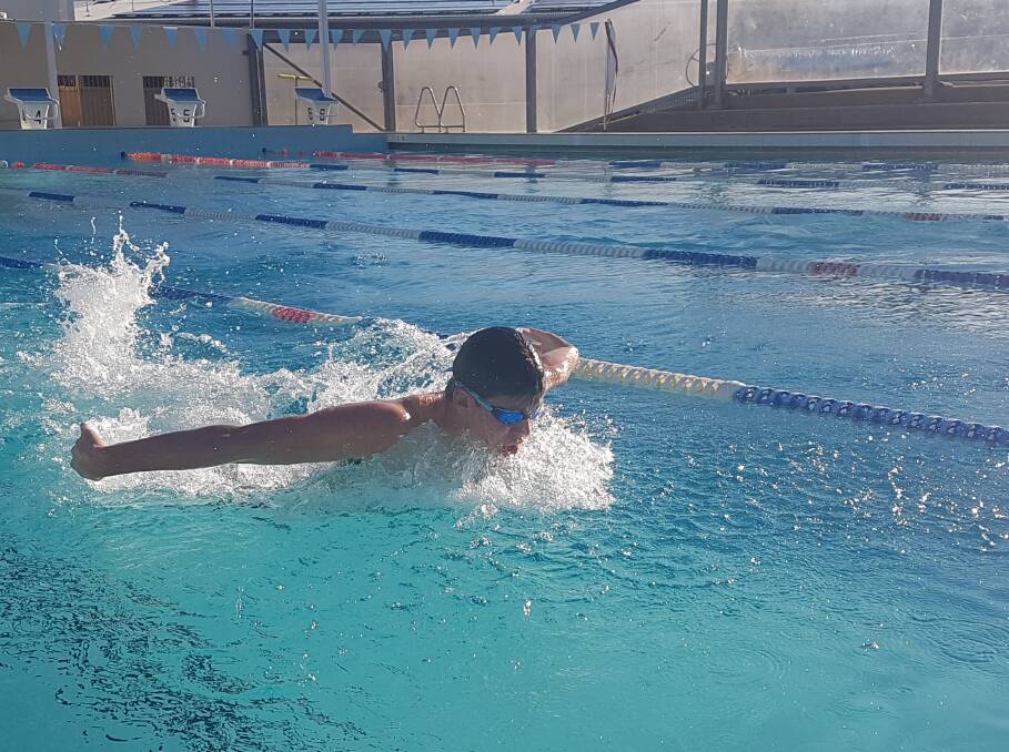 RISING TO THE CHALLENGE: Nathan Smith testing some butterfly at the Port Macquarie Olympic Pool.