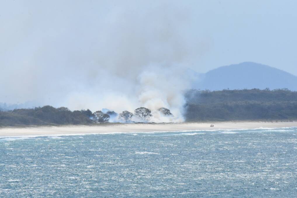 BURNING: The bushfire on Port Macquarie's North Shore.