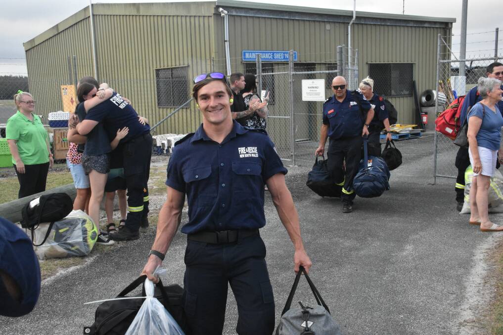 OUT OF THE FIRE: Mid North Coast firefighters return to Port Macquarie Airport.