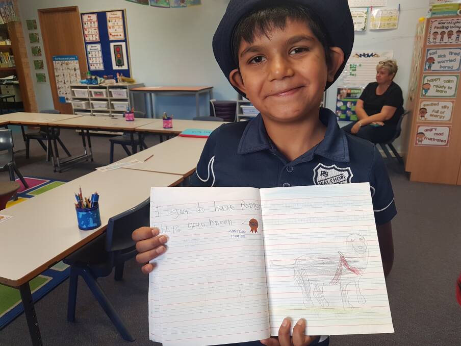 CREATIVE ARTWORK: Wauchope Public School student Jaziah Taylor-Chilly with a drawn picture of Pepper.