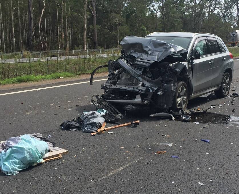 Crushed: The silver Suzki Vitara driven by the 24 year old woman after it collided with the back of a caravan around 10.45am on Monday, March 25. Photo: Port Macquarie Police.
