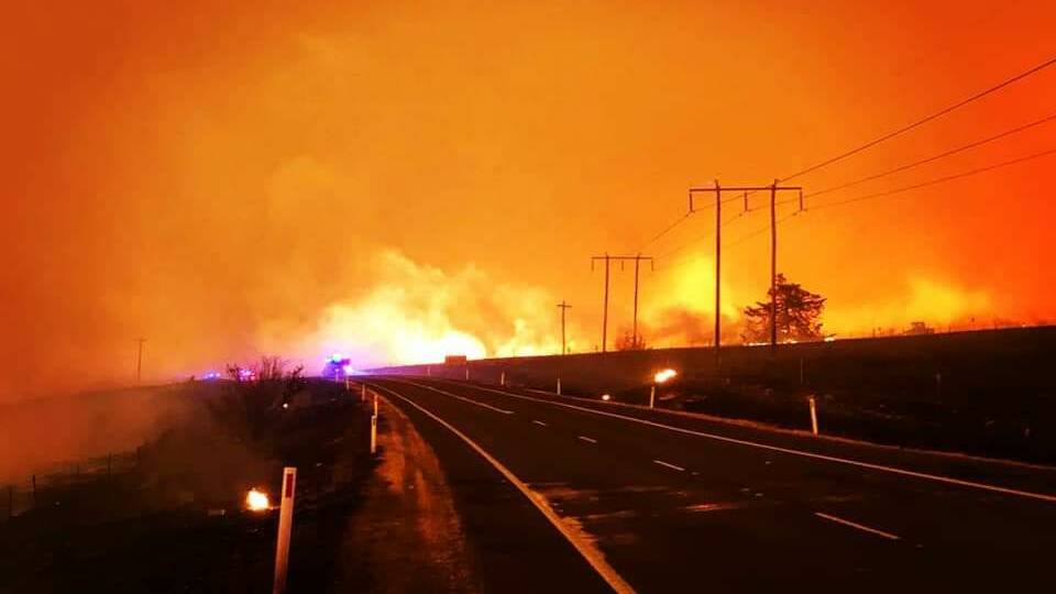 BLAZING SOUTH COAST: Flames reach out as Port Macquarie firefighters get to the fire zone. Photo: Supplied/Fire and Rescue NSW Port Macquarie.