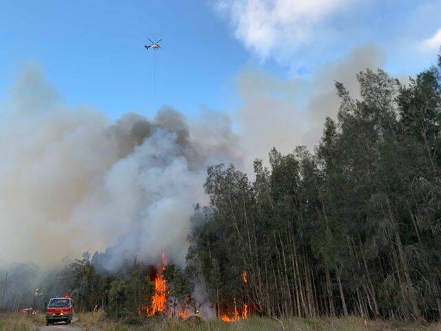 WEATHER WARNING: Fire crews battling the Lindfield Park Road bushfire. Photo: NSW Rural Fire Service Mid Coast District.
