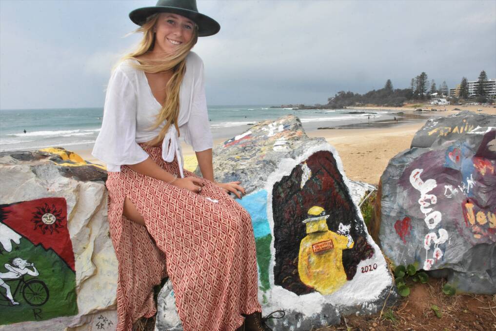 FIREFIGHTING TRIBUTE: Port Macquarie 17 year-old Laura Dean with the painting at the breakwall.