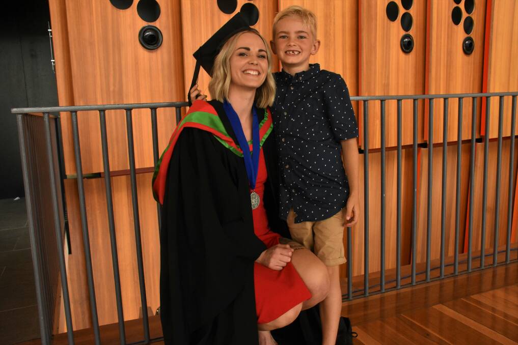 GRADUATION DAY: Charles Sturt University graduate Jessica Denham with her son, Malakai, 7.