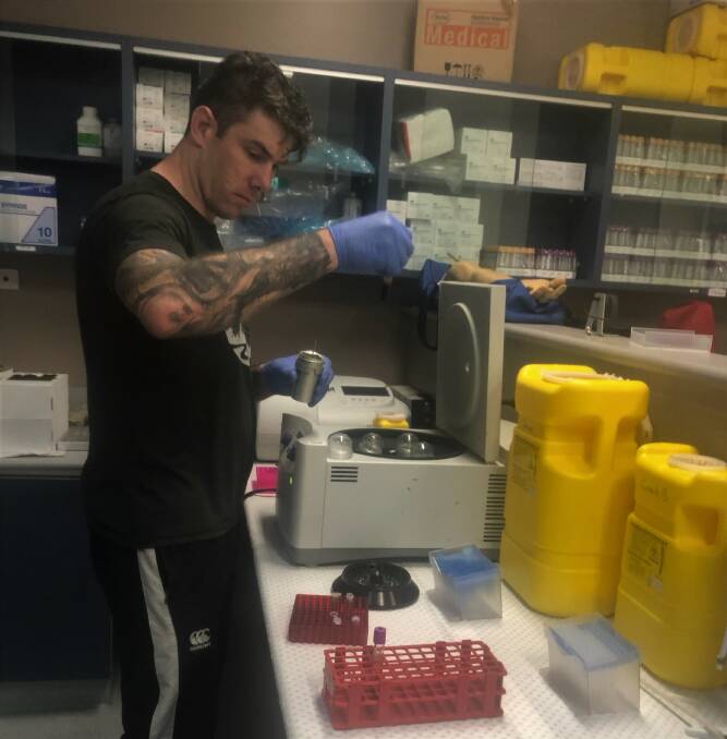IN THE LAB: PhD student Grant Brechney testing blood samples from the project. Photo: Supplied.