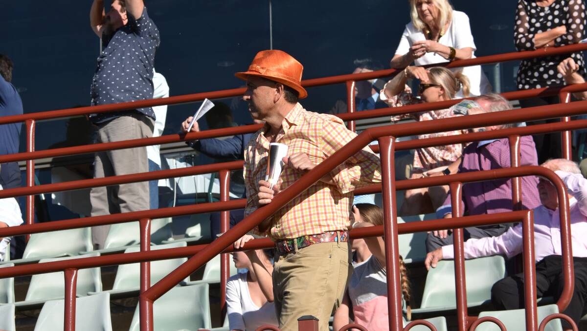 ON WATCH: Stable representative Neil Paine in the stands during the race.