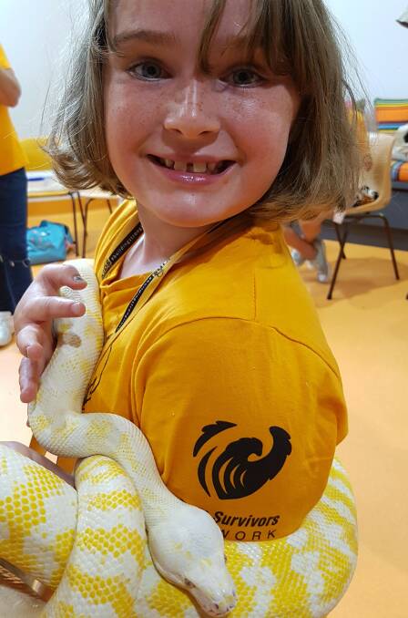 Snakes: Madison Hastings is with Walter the snake from the Billabong Zoo.