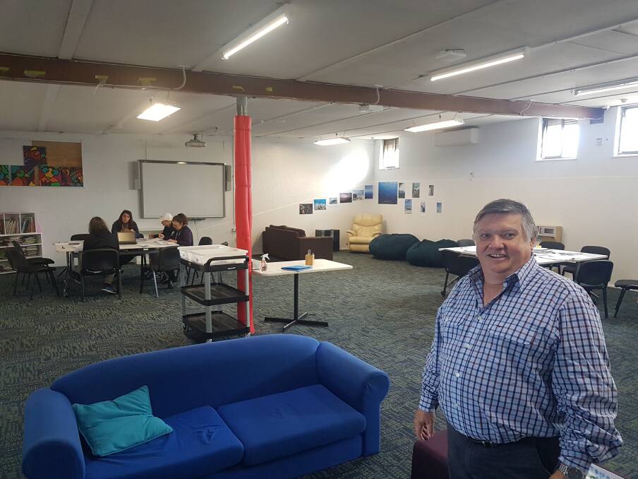 STUDYING: Principal John Beaumont in a new teaching and learning area at the college.