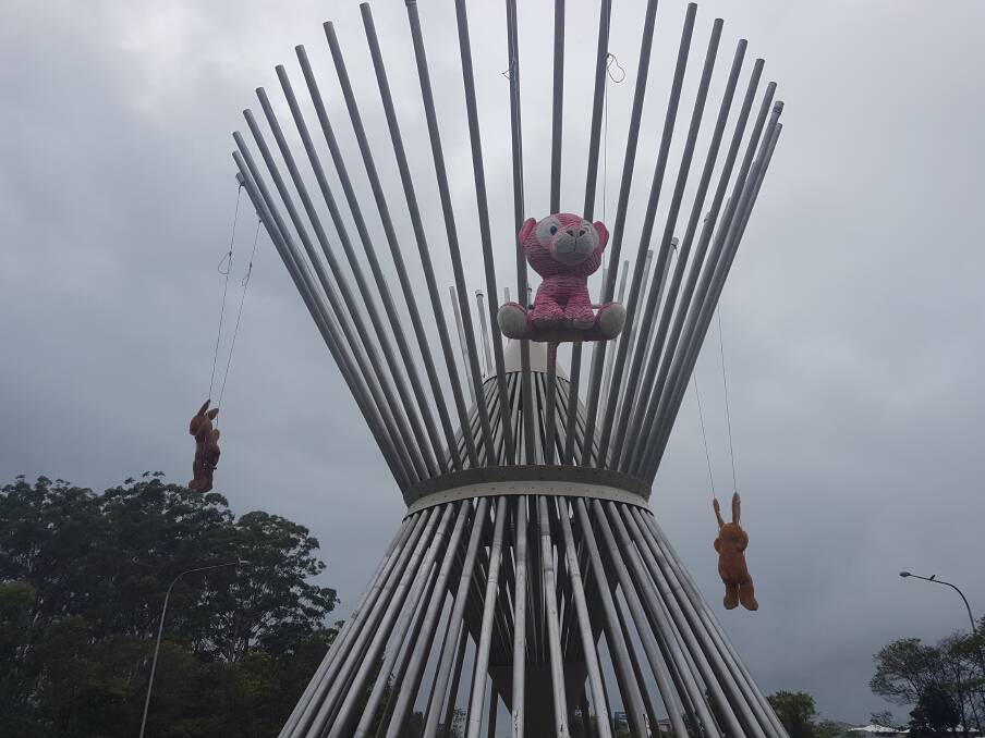 Stuffed animal adventurers: Three rabbits and a pink tiger were discovered swinging from the roundabout sculpture on April 1.