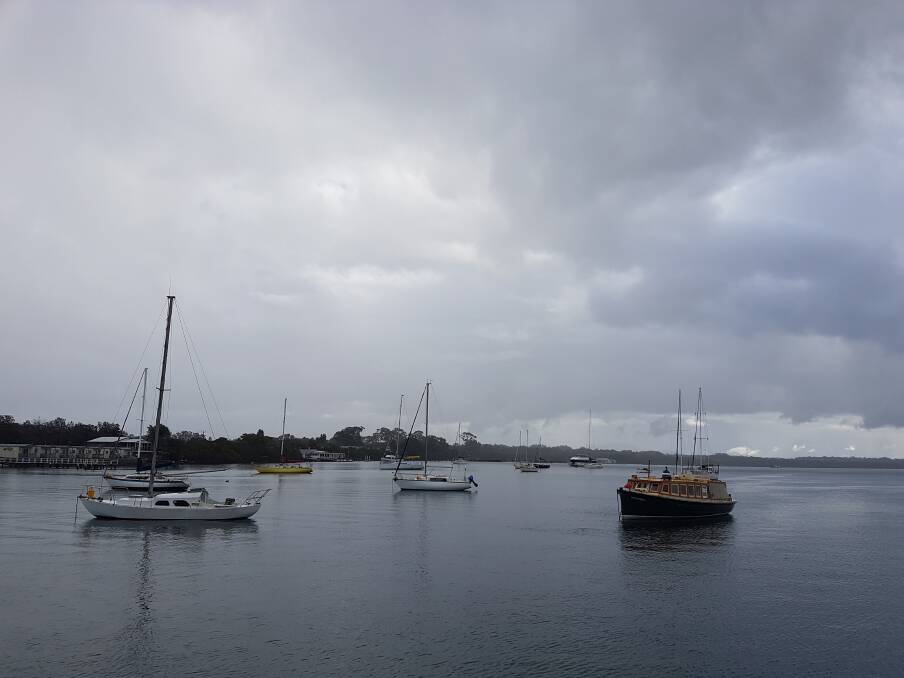 Wet weather: Boats anchored in the Hastings River.