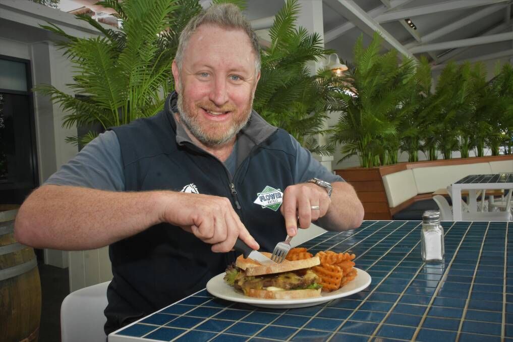 IN THE RUNNING: Flower Hotels managing director Alistair Flower with a steak sandwich at Settlers Inn Hotel.