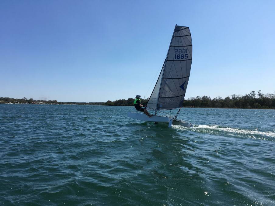 STANDING TALL: Dion Carle on Scaramouche, who went on to win the catamaran spring series race five, on handicap. Photo: Port Macquarie Sailing Club.
