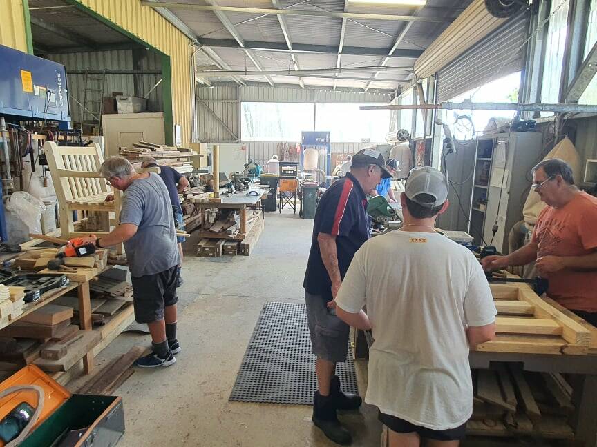 Members working at the Kendall Men's Shed.