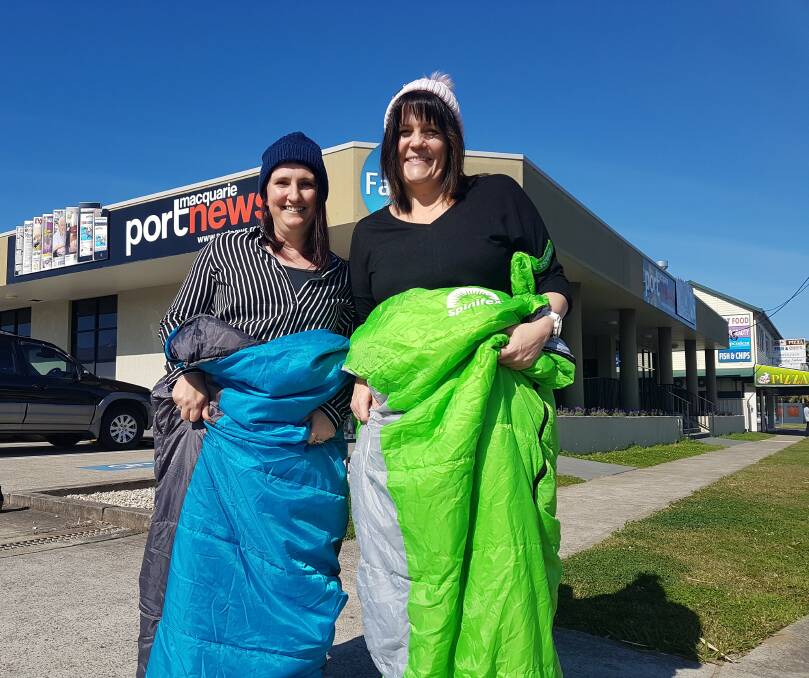 SLEEPING OUT: Port Macquarie News' real estate sales representative Bronwyn Herden and sales representative Sue Fitzgerald with their sleeping bags.