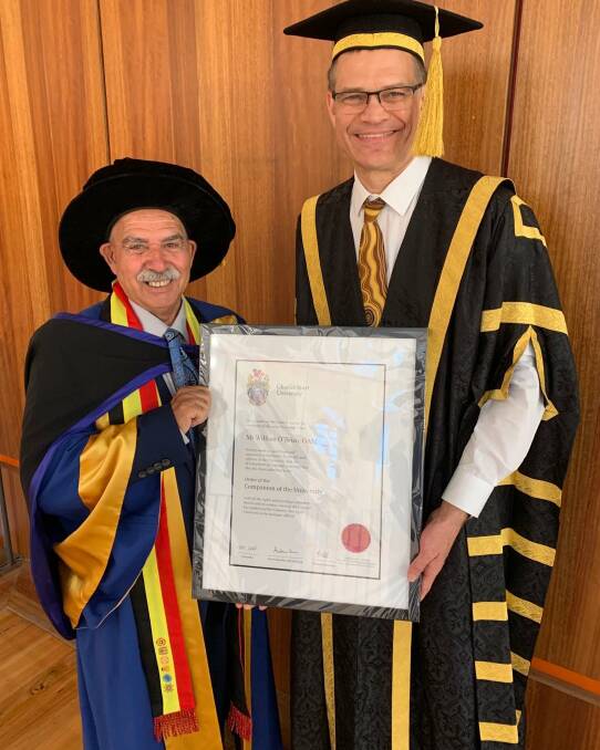 IMPORTANCE OF EDUCATION: Charles Sturt University Vice-Chancellor Andrew Vann with William Uncle Bill OBrien at the graduation ceremony in Port Macquarie. Photo: Supplied/CSU.