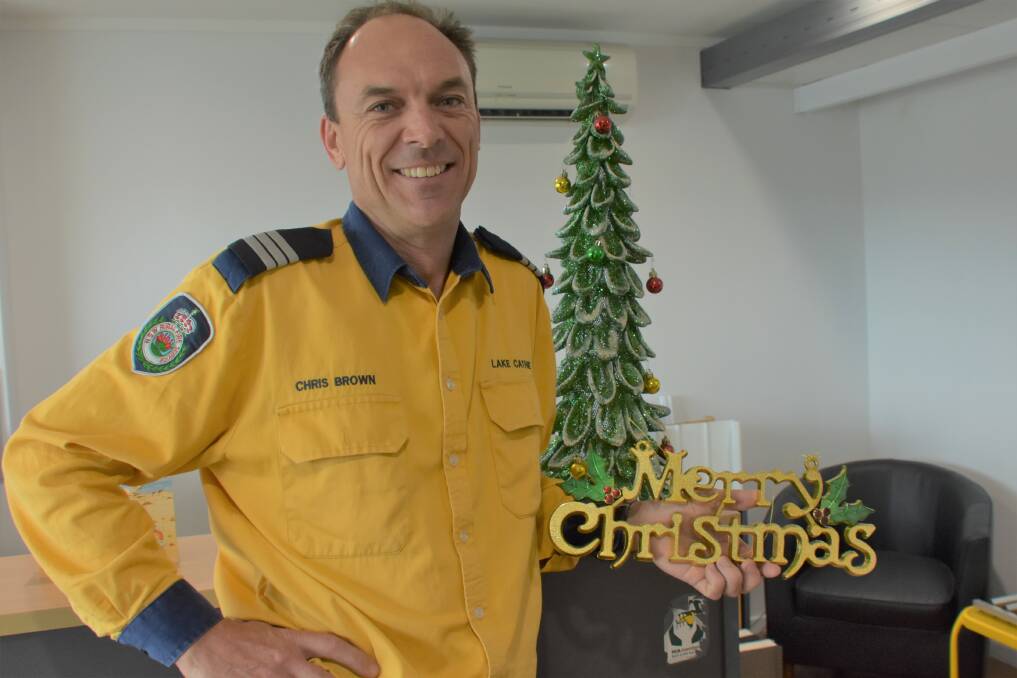 MERRY CHRISTMAS FROM THE TEAM: Lake Cathie Rural Fire Brigade captain Chris Brown.