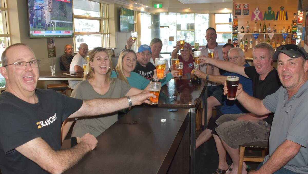 CHEERS: Port Macquarie syndicate members at the Port Macquarie Hotel.