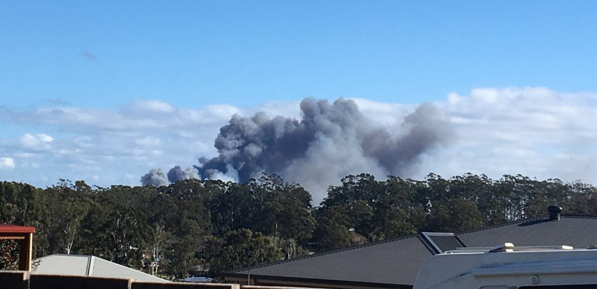SMOKE PLUME: A cloud of black smoke from the Lindfield Park Road bushfire.