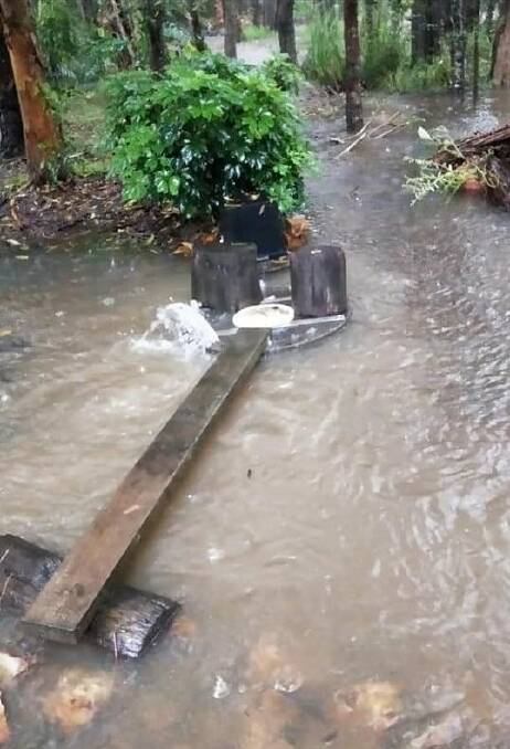 ONGOING PROBLEMS: An overflowing Rodley Street manhole in Bonny Hills. Photo: Supplied/Ross Smith.