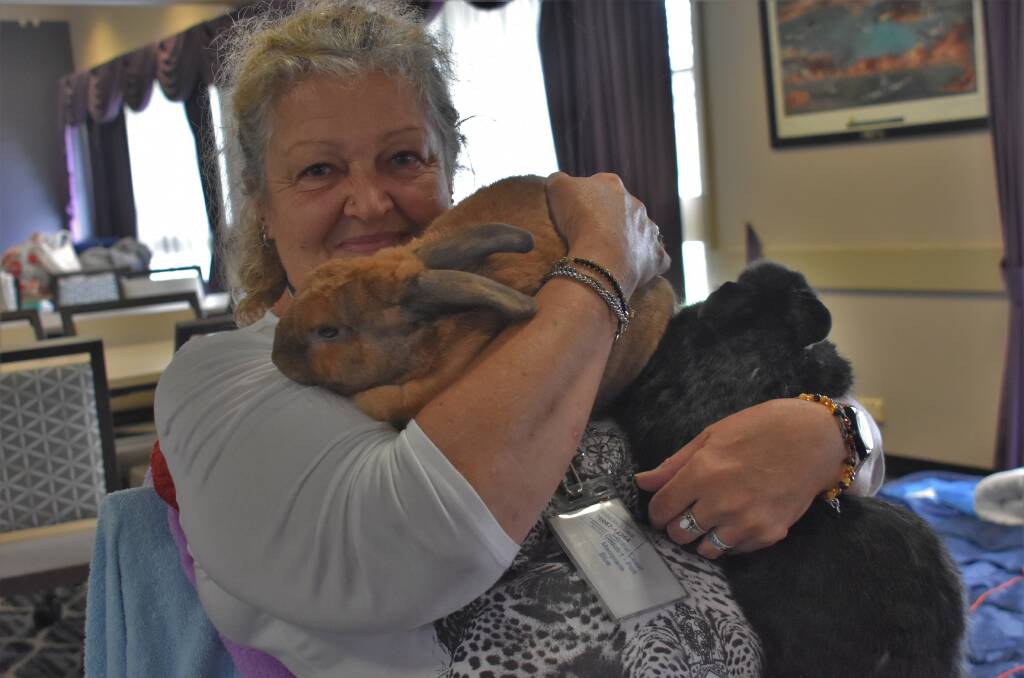 SEEKING SHELTER: Donna Luck with two pet rabbits.