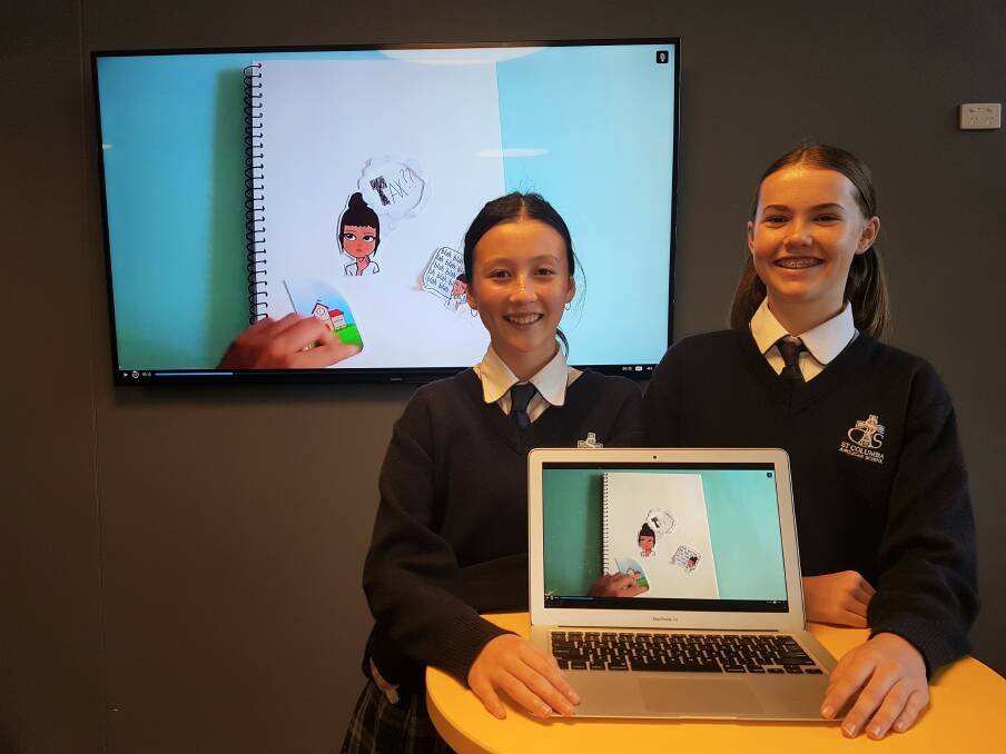 Taxation matters: Port Macquarie students Sonya Maloney and Elise Burke with last year's Tax, Super + You competition video.