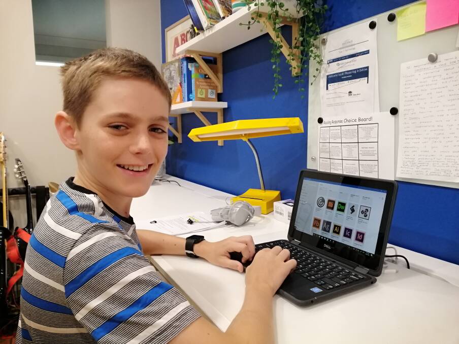 NEW TECHNOLOGY AT HOME: Year seven student Drew de Silva collected a laptop as part of the online equipment roll-out. Photo: Hastings Secondary College/Supplied.