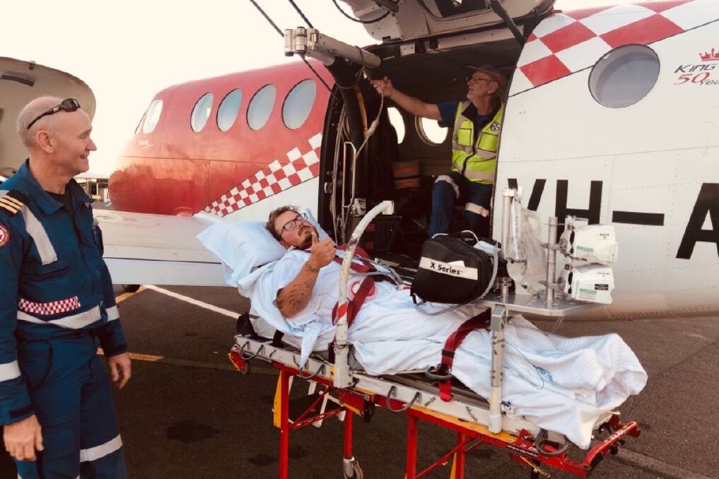 After the accident: Sam Hine being transferred by air to hospital. Photo: Supplied.