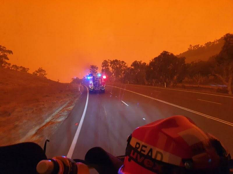 RED AHEAD: The sky is plagued with smoke as Captain Rob Read approaches the fire zone. Photo: Supplied/Fire and Rescue NSW Port Macquarie.