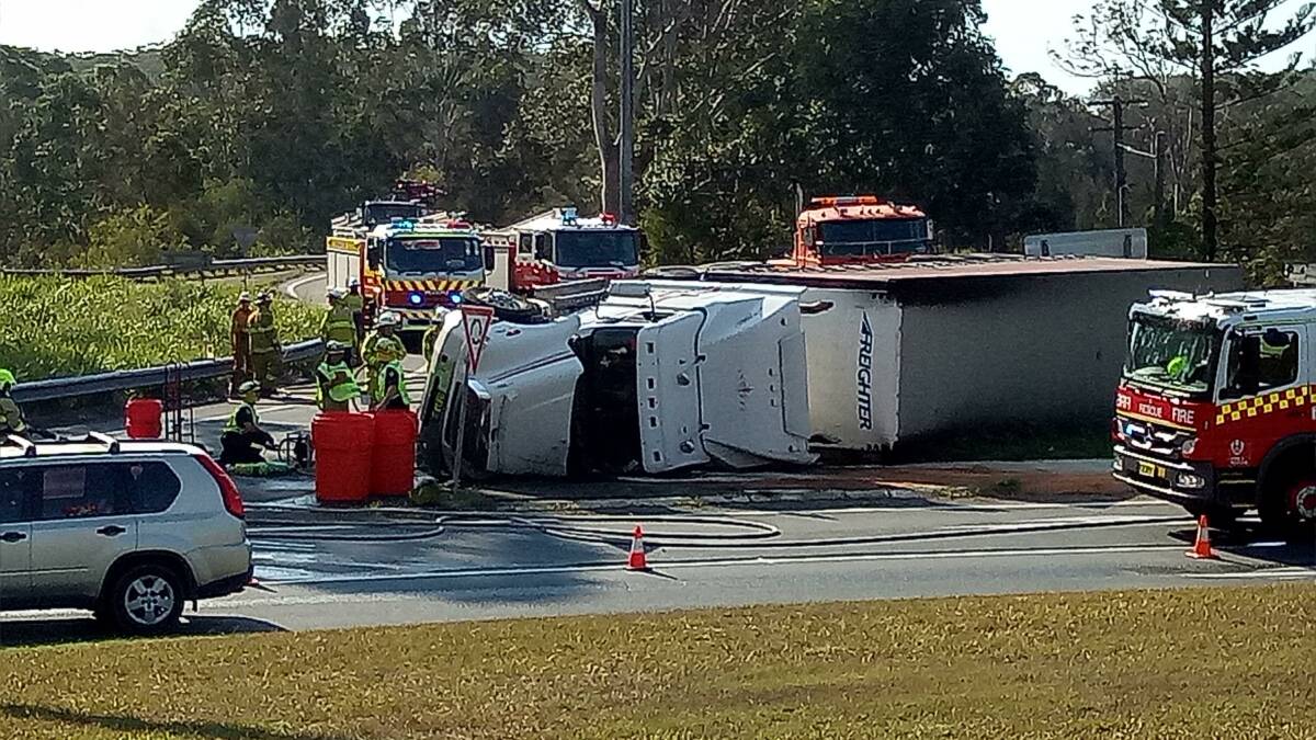 Roll over: The semi-trailer on its side in Port Macquarie. Credit: Joshua Pring
