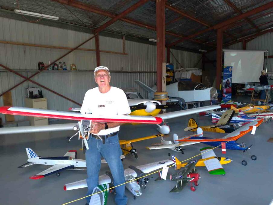 FLYING HIGH: Ian Moss displaying one of the many models for the Hastings Aero Club celebrations this year. Photo: Supplied.