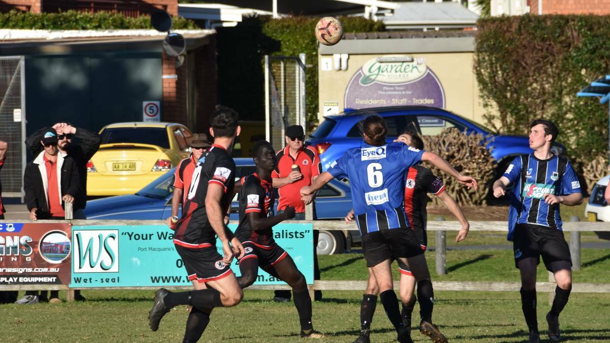 SPLIT CONFERENCES: Coffs City United and Port Saints gather up the footy.
