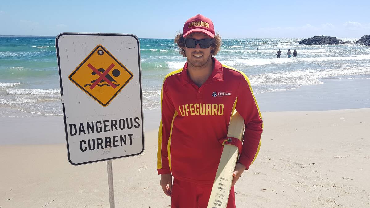 Warning signs: Seasonal lifeguard Kye Polverino with a dangerous current sign.