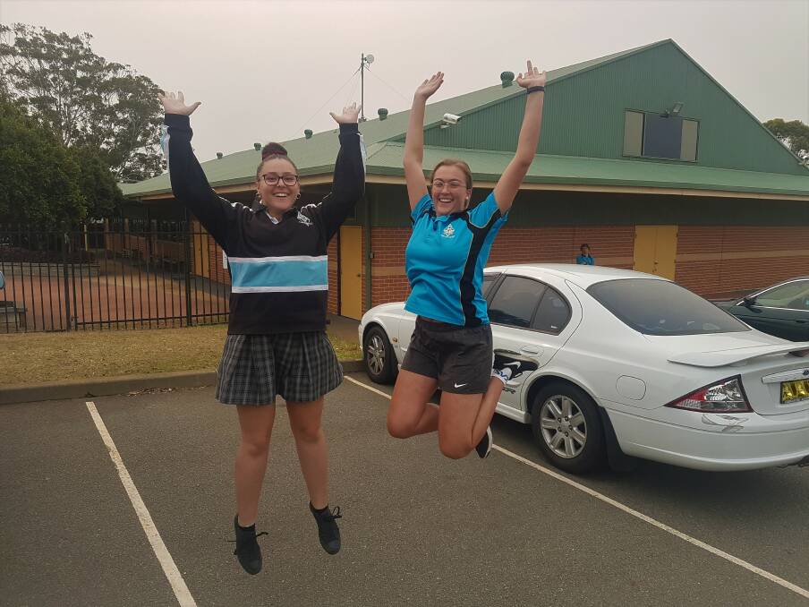 HOME FREE: Year 12 students Alyssa Castelletto and Amelia Stennett jump for joy after finishing their exams.