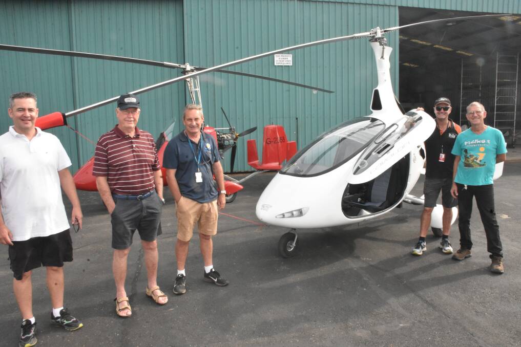 GYROCOPTER CRAZE: Hastings District Flying Club members Brian Chow, Jon Bown, Gavin Law and Rod Davison with Neil Farr.