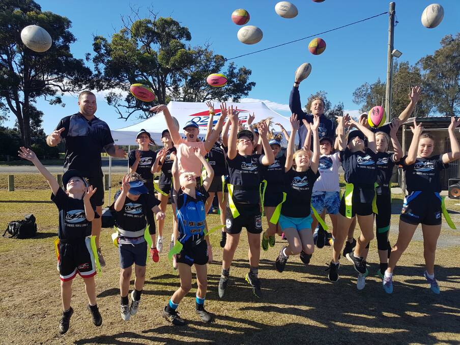 Having a ball: Port Macquarie children at an Oztag clinic held at the Tuffins Lane ovals.