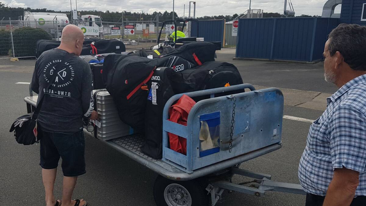 Port Macquarie Airport: Ironman bicycles being unloaded.