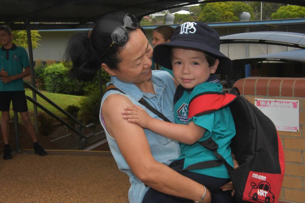 BIG DAY: Lili Chen with son, Justin at Tacking Point Public School.