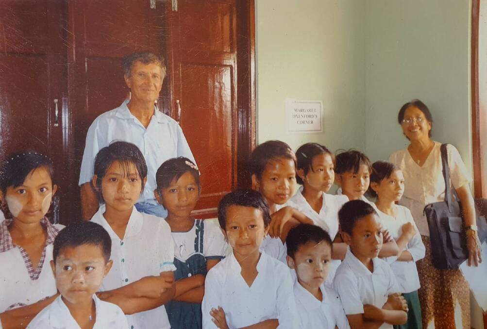 PASSIONATE CARERS: Tin Hta Nu and Ian Oxenford providing aid to schools and orphanages in Myanmar (Burma).
