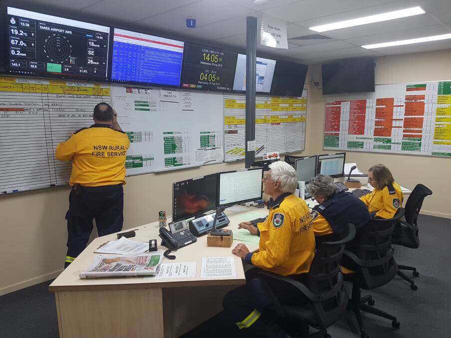 A CALL AWAY: Radio operators delegate tasks to crews on the ground.
