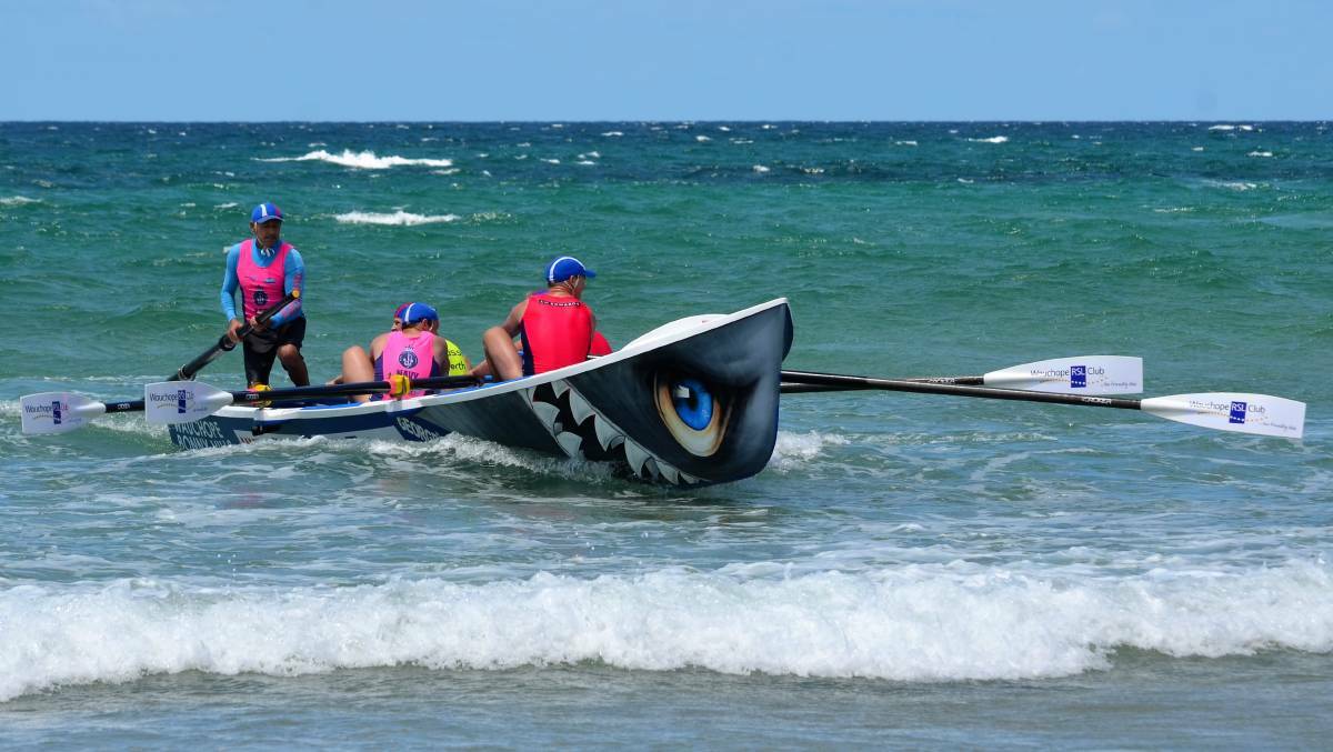 BIG SWELL THIS WEEKEND: A boatcrew tackles round five of the North Coast Surf Boat Series at Woolgoolga.