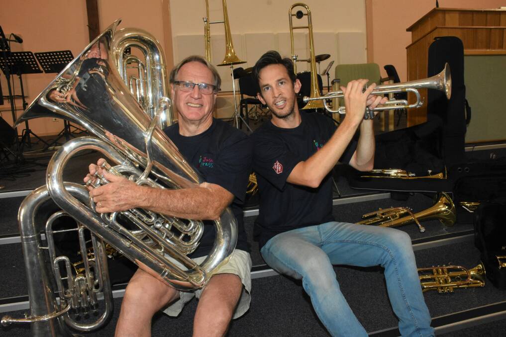 High note: Brass band teacher, Jim Gebhardt with program director David James and some of the brass instruments sourced for students.
