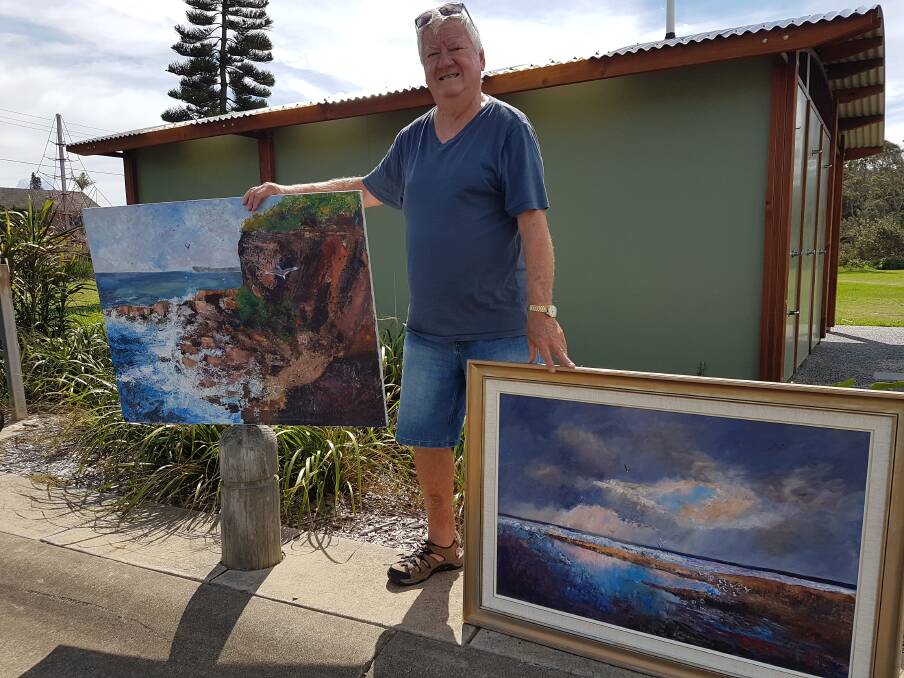 Mural: Brian Barker with some of his works as inspiration for the mural competition.