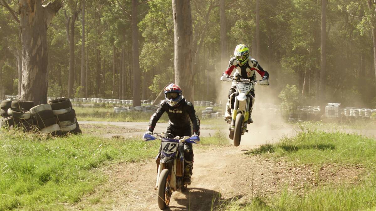 BUMPY RIDE: Supermoto riders travelling over a dirt section in Port Macquarie. Photo: Supplied/Jean-Gabriel Laine.