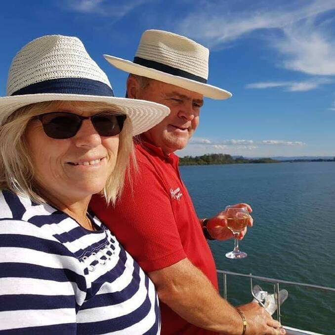 A WORLD AWAY FROM SOUTH AFRICA: Debbie and Gary Gallagher on a cruise in Port Macquarie. Photo: Supplied.