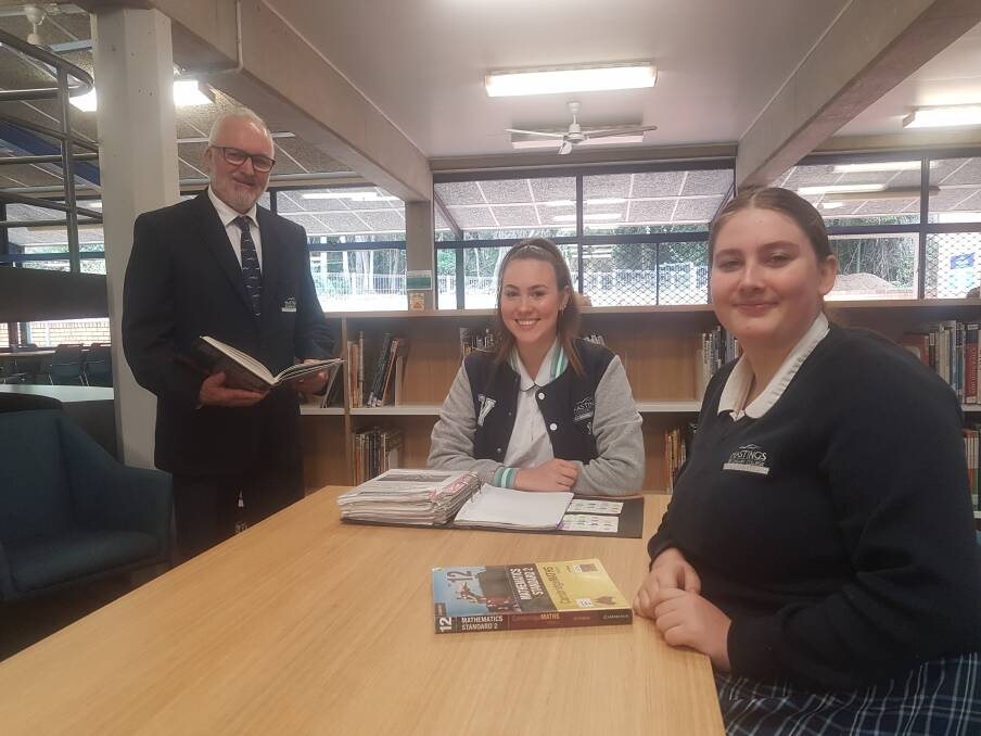 Ian Ross, principal of Hastings Secondary College Westport Campus with year 12 students Zoe Davies and Imogene Salt.