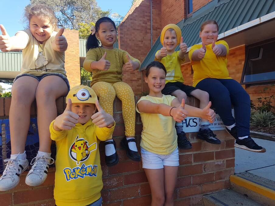 Show of support: Local students Mia-Rose Hogan, Calais Rooney, Kate Tran, Eve Collins, Ronan Treacy and Charlee Bowes enjoying a free dress day in yellow.